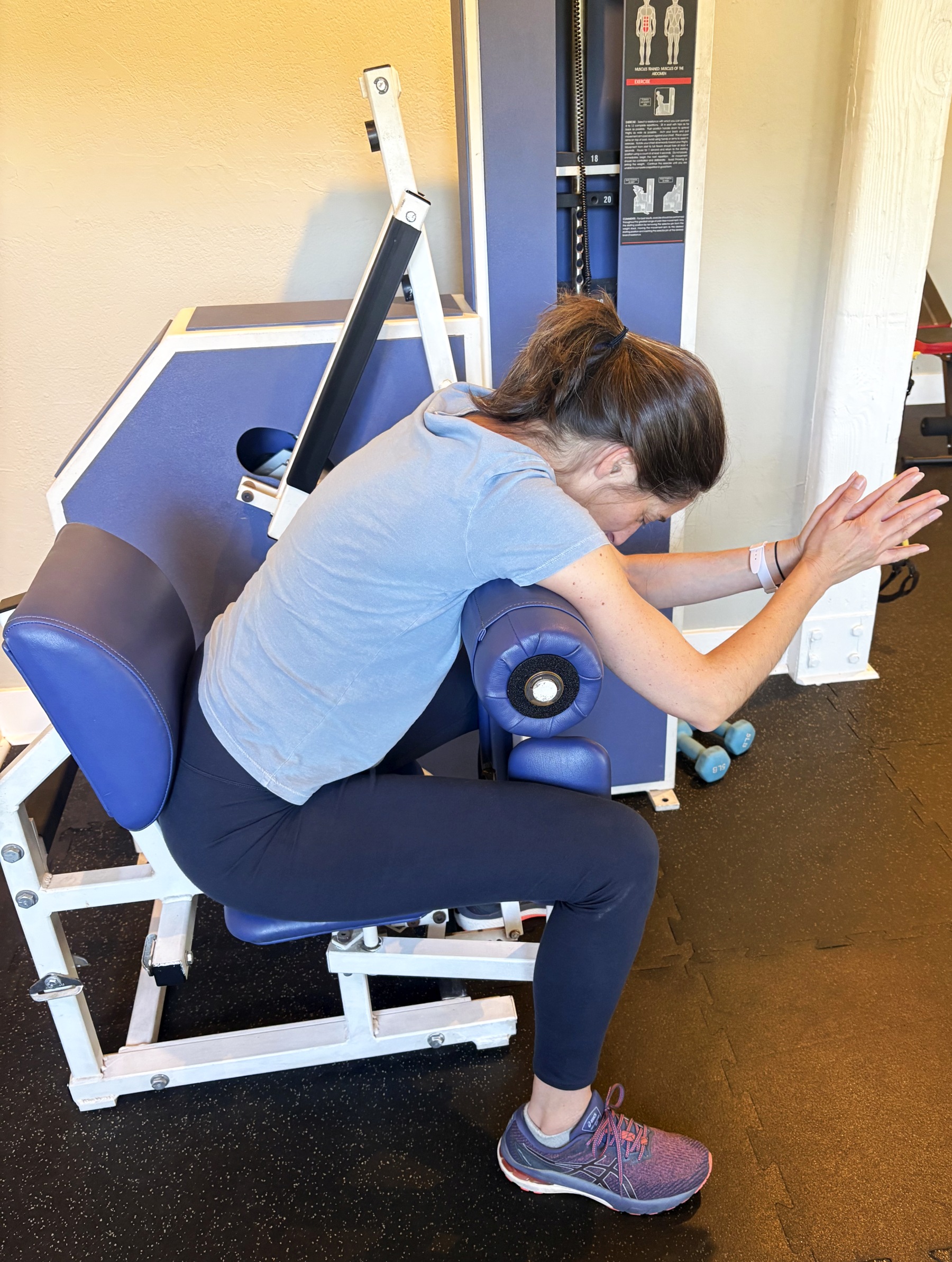 Caro getting her core strength work out, on our slow motion abdominal machine before her fun chosen cardio workout
